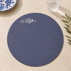 Blue resin-coated linen round placemat with off-white sardine embroidery by MI RE LA