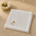 Off White classic linen cocktail napkin with brown bee embroidery by MI RE LA