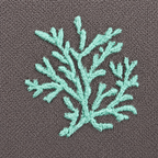Teal embroidered leaf design on a brown fabric background