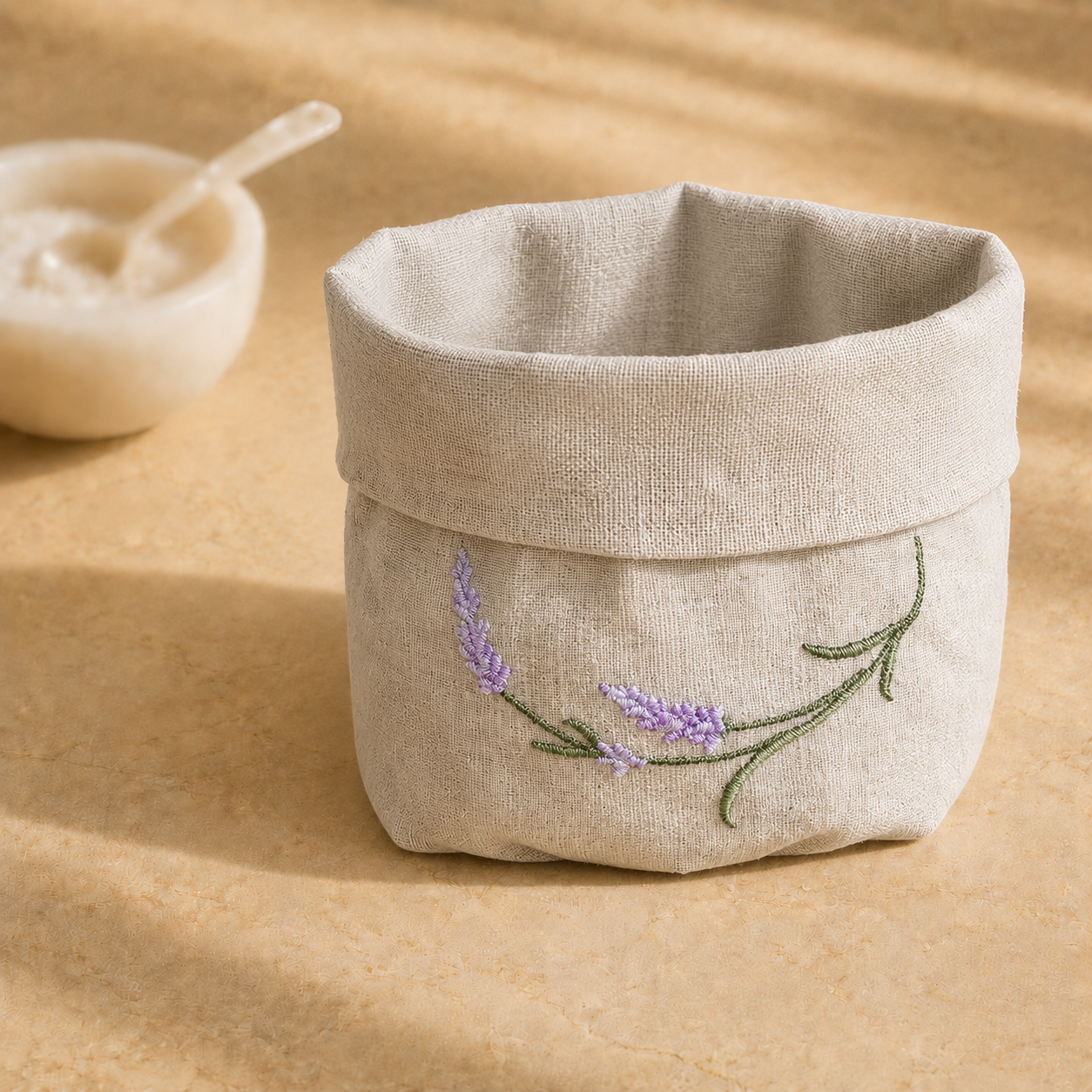 Oatmeal stone resin-coated linen basket with lavender sage embroidery by MI RE LA