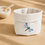 Off-white resin-coated linen basket with dragonfly blue embroidery by MI RE LA