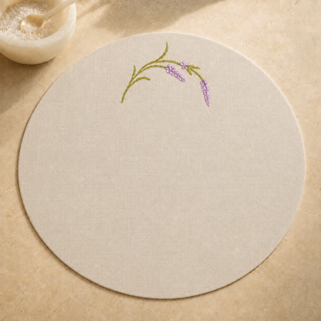 Oatmeal stone resin-coated linen round placemat with lavender sage embroidery by MI RE LA