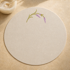 Oatmeal stone resin-coated linen round placemat with lavender sage embroidery by MI RE LA
