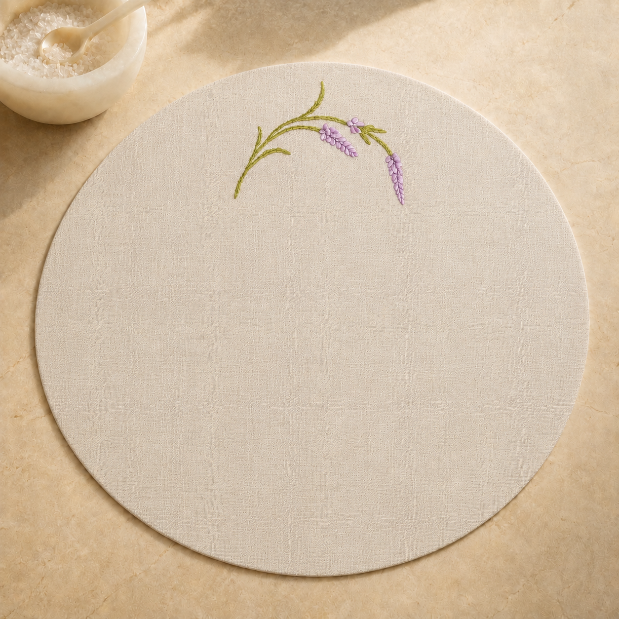 Oatmeal stone resin-coated linen round placemat with lavender sage embroidery by MI RE LA