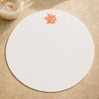 Off-white resin-coated linen round placemat with orange coral embroidery by MI RE LA