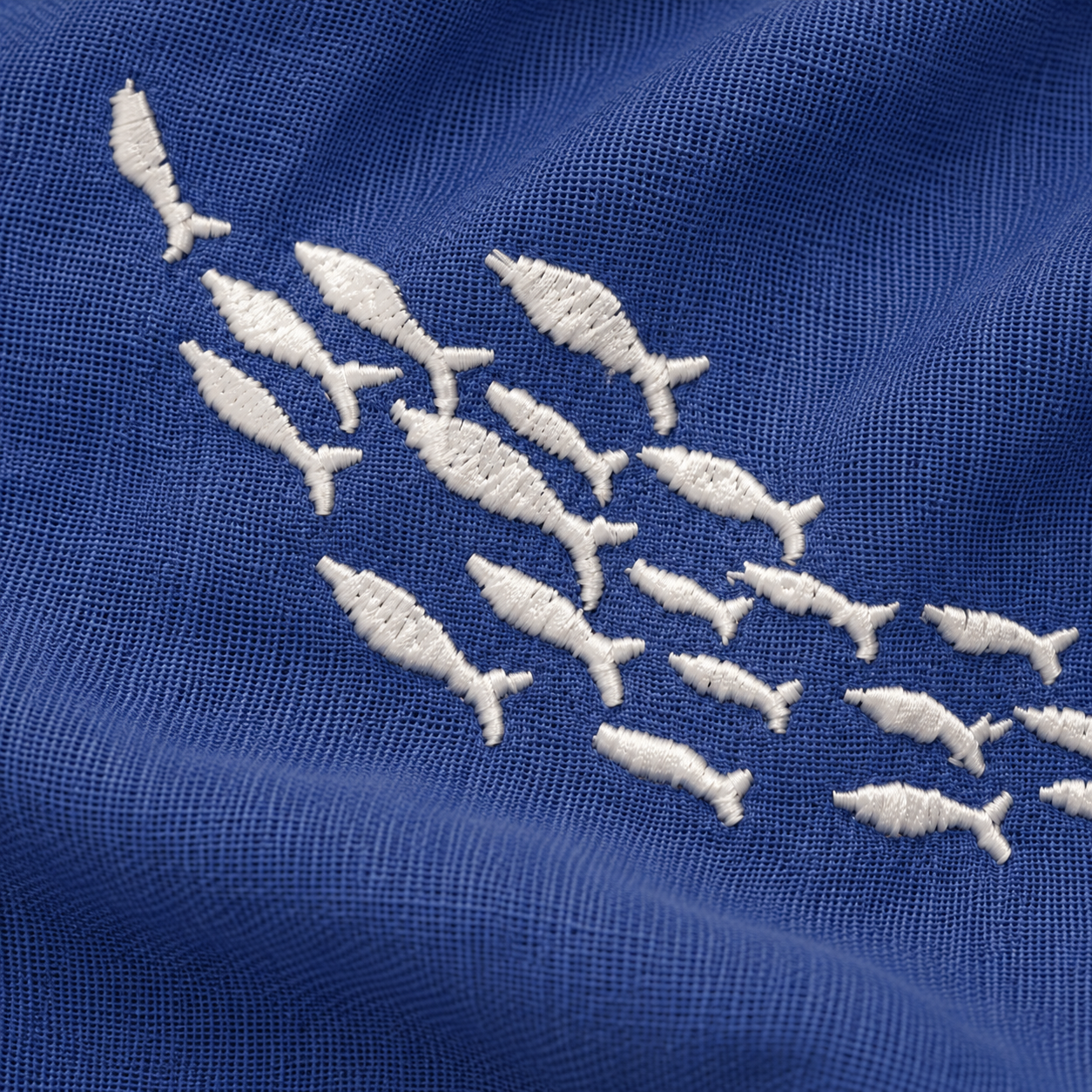 Off-White fish embroidery on Mediterranean Blue linen from Collezione Amalfi